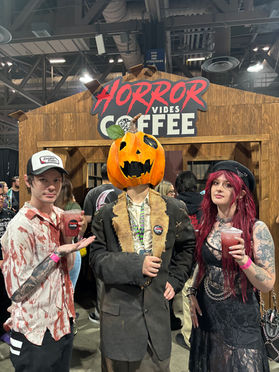 Horror fans gathering at the Horror Vibes Coffee booth